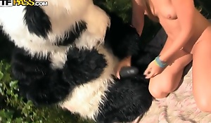 Panda's huge strapon dildo made the girl aroused too, and she got down to suck it. Then she let the panda prosperity her with that brutal dildo. Oh, this hot sex play is a must-see!