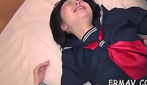 Agreeable japanese chick gives vibrant beak sucking