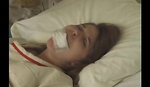 Pretty brunette in Straitjacket taped mouth forced required to bed hospital